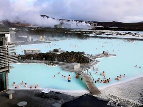 Visitors sit in the geothermal waters at the Blue Lagoon close to the Icelandic capital of Reykjavik — one of the stops on Travel Guild Inc.’s Around the World by Private Jet Tour that will be departing Calgary on Nov. 3.