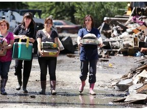 Volunteers from Our Lady of Assumption school in Bowness helped clean up in the community a few days after the flood in June 2013.