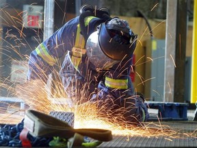 A structural fitter welder works on a platform being built for Alberta's oilsands at a Calgary manufacturing facility. Large-scale projects are moving ahead in Alberta, meaning companies are competing for labour.