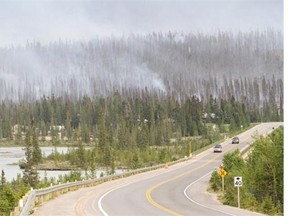 A wildfire encroaches on Highway 93 N. on the northeast edge of Banff National Park.