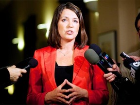 Wildrose Party Leader Danielle Smith speaks to reporters in Calgary, Alta., Thursday, Jan. 24, 2013. Smith is coming under fire for refusing to say whether she believes climate change exists.THE CANADIAN PRESS/Jeff McIntosh