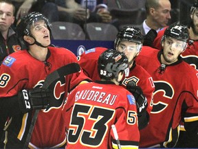 Calgary Flames prospect Johnny Gaudreau is contratulated at the bench after scoring on the Edmonon Oilers in the first period in the Youngstars Tournament in Penticton, BC