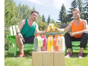.Zack Lister, left, and Jeff Turnbach, right, owners of Well Juicery, enjoy the fruits (and vegetables) of their labours in Calgary on Wednesday, July 23, 2014.