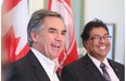 Alberta Premier-designate Jim Prentice and Calgary Mayor Naheed Nenshi share a laugh while speaking with the media after meeting at Calgary’s City Hall on Tuesday.