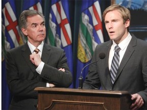 Alberta Premier Jim Prentice and New Brunswick Premier Brian Gallant meet at the McDougall Centre in Calgary on October 20, 2014.