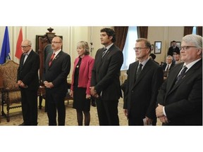 New Alberta Premier Jim Prentice introduces new ministers during their swearing in ceremony In Edmonton on Monday.