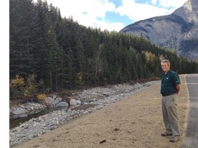 Bill Hunt, manager of resource conservation with Banff National Park, stands between  the newly repaired Legacy Trail and the restored creek.