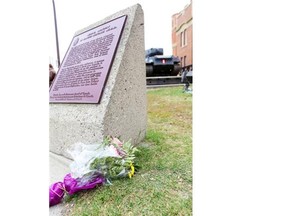 A bouquet of flowers rests outside Calgary’s Mewata Armoury on Wednesday.