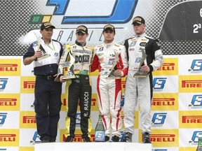 Calgary's Ryan Verra, right, poses on the podium at Porto Alegre, Brazil last month.