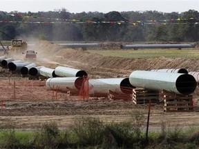 Large sections of pipe are shown in Sumner Texas in an Oct.4, 2012 file photo. Keystone XL is a proposed 1,897-kilometre pipeline that would carry crude oil from Hardisty, Alta., to Steele City, Neb., where it would link up with other pipelines that run to the Gulf Coast and the U.S. Midwest. THE CANADIAN PRESS/AP Photo/Tony Gutierrez