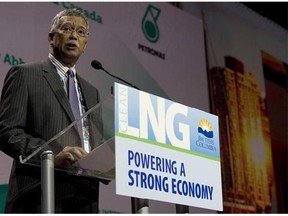 Petronas CEO Shamsul Abbas speaks during a 2014 LNG conference in Vancouver. Malaysia's Petronas is threatening to quit a proposed liquefied natural gas project, complaining the government hasn't done enough to convince the oil and gas company that it would be worthwhile to invest billions of dollars, the Financial Times reported Thursday.