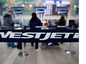 WestJet Airlines will start charging some economy passengers for their first checked bag. Reader says airlines should crack down on large carry-on bags.
