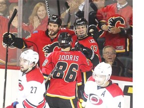 Calgary Flames, from left, Brandon Bollig, Josh Jooris and Lance Bouma celebrate after Bouma scored in the third period.