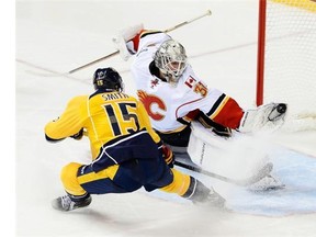 Calgary Flames goalie Karri Ramo gloves a shot by Nashville Predators centre Craig Smith in the third period, which saved the game for the Flames.