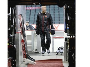 Calgary Flames head coach Bob Hartley leaves the ice after Flames practice at the Scotiabank Saddledome on Tuesday. He is giving no credence to what other people think about his hockey team.