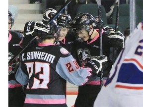 The Calgary Hitmen celebrate a goal by Travis Sanheim against the Regina Pats during second period WHL action at the Scotiabank Saddledome on Sunday.