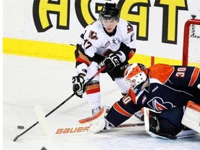 Calgary Hitmen forward Pavel Padakin, seen battling Kamloops Blazers goalie Bolton Pouliot for a loose puck durng a game last February, has been dealt to the Regina Pats.