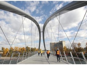The Calgary Municipal Land Development Corporation staff lead a media tour across the new St. Patrick’s Island bridge on Wednesday, Oct. 7, 2014.