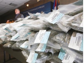 Calgary Police drug unit Staff Sgt. Tom Hanson displays 54 kilograms of marijuana seized after a tip from the public.