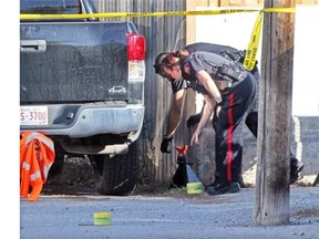 Calgary Police secured a home and alley in Marlborough Park on October 4, 2014 after reports of shots fired and one person being shot.