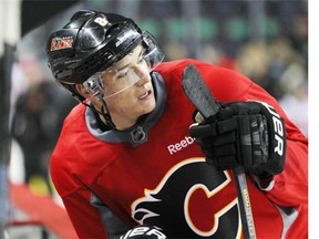 Calgary Flames centre Joe Colborne rests after a drill at Flames practice on Tuesday.