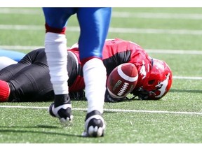 Calgary Stampeders running back Jon Cornish lay on the field after taking a clothesline from Montreal Alouettes defender Kyries Hebert in the season opener. He missed six games with a concussion as a result.