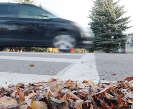 Cars drive through a crosswalk where two pedestrians – including a child – were struck in 2014.