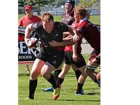 Clayton Panga of the Prairie Wolf Pack is tackled by Mike Hamson of the Atlantic Rock during a Canadian Rugby Championship match earlier this month. The Wolf Pack need the Rock’s help against Ontario this Saturday if they are to win the trophy.