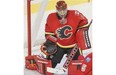 Flames goalie Jonas Hiller, makes a save against the Edmonton Oilers during preseason action last month.