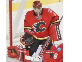 Flames goalie Jonas Hiller, makes a save against the Edmonton Oilers during preseason action last month.