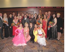 Dancing With Calgary Stars competitors and their partners pose with event organizers and Calgary Dance Foundation students.
