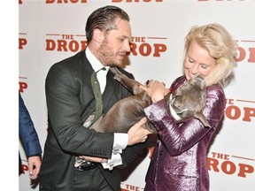 The Drop co-stars Tom Hardy, left, Zora the dog and Noomi Rapace. “I am drawn to characters that are struggling,” Rapace says. “And I think I can do that because I feel quite light inside.” Theo Wargo/Getty Images