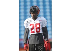 efensive back Brandon Smith watches drills during Calgary Stampeders practice on Wednesday.