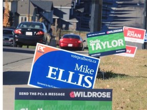 Election signs from the PC’s, the Wildrose and Liberal parties line 14th Avenue S.W. in Aspenwoods on Friday. The neighbourhood is in the Calgary West riding that is one of three in the city gearing up for the provincial byelection on Monday.