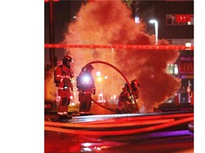 Fire crews on the scene of an underground electrical fire near 5th Avenue and 8 Street SW in Calgary on October 11, 2014.