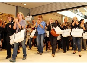 The first customers come through the doors as over 1000 customers were lined up for the grand opening of the Nordstrom store in Chinook Centre on September 19, 2014. Other retailers are paying attention and upping their game.