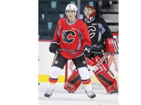 Flames centre Mikael Backlund skates with teammates during training camp Friday at the Saddledome. Backlund hopes to play in Saturday’s final pre-season game as Calgary travels to Winnipeg.
