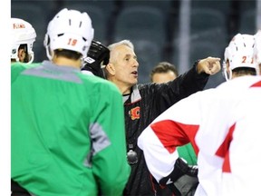 Flames head coach Bob Hartley gives instructions to players during Friday’s training camp at the Saddledome.