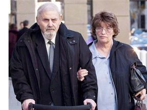 Former court-appointed psychiatrist Aubrey Levin, left, who was accused of sexually assaulting 10 of his patients, leaves court in Calgary on Oct. 15, 2012, with his wife Erica. Erica Levin, 69, has been charged with contempt of court.