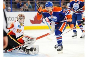 Greg Chase of the Edmonton Oilers (and Calgary Hitmen) celebrates a second period goal on Calgary Flames goalie Joni Ortio in a split-squad preseason game on Sunday night.