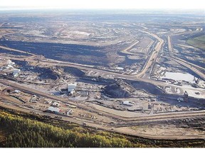 Auditor General Merwan Saher slammed an initial oilsands report for being 15 months late. An oilsands project is seen in this file photo near Fort McMurray.