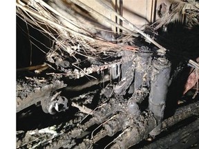 Handout photo showing fire damage in the concrete room under the manhole that the wires and cables pass through. The result was a large power failure through the west end of downtown starting Saturday night.