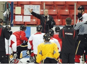 Head Coach Bob Hartley goes over a drill as the Calgary Flames took to the ice at the Stampede Corral for practice on Monday. They are preparing to host the Vancouver Canucks on Wednesday.