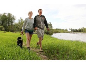 High River Mayor Craig Snodgrass, with his wife Lindsay and dog Simon, commends the town for its post-flood development.