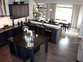 The upstairs bonus room in the Blackstone show home by Jayman MasterBuilt in Riviera Riverstone has large windows for plenty of light.