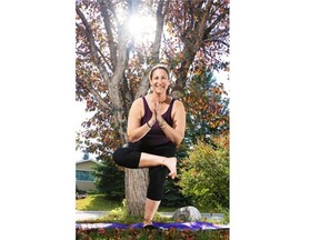 oga instructor Johanna Steinfeld demonstrates the Pigeon in a Tree pose.