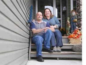 Jerry Bender, left, is pictured with his wife Kim at outside their home in Calgary. Jerry is facing terminal brain cancer, but thanks to the Give a Mile program, his family from Ontario has flown in to help support him and his wife.