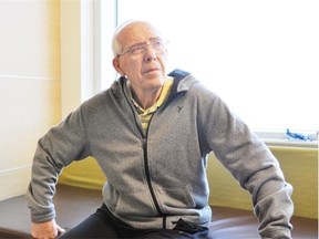 Jerry Orpe sits in his room in the South Calgary Health Campus on October 8, 2014. He is currently staying in the orthopaedic unit at the hospital while he and his family wait for a bed in one of their three preferred long term care facilities, facilities which can accommodate both his Alzheimer’s and his physically fit body.