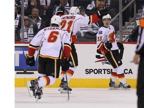 Johnny Gaudreau of the Calgary Flames celebrates his first goal of the season against the Winnipeg Jets in the second period on Sunday.