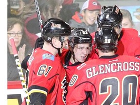 Johnny Gaudreau, middle, celebrates his goal with teammates during their NHL pre-season game against the Colorado Avalanche on Tuesday.